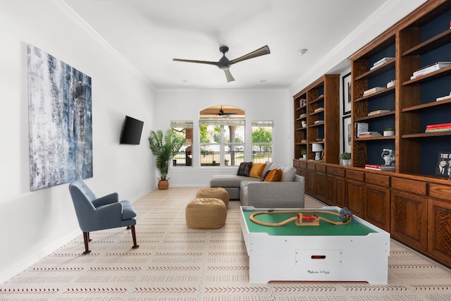 10833 Olympia Fields Loop, Austin, TX 78747 - living area featuring ceiling fan, crown molding, baseboards, and light colored carpet