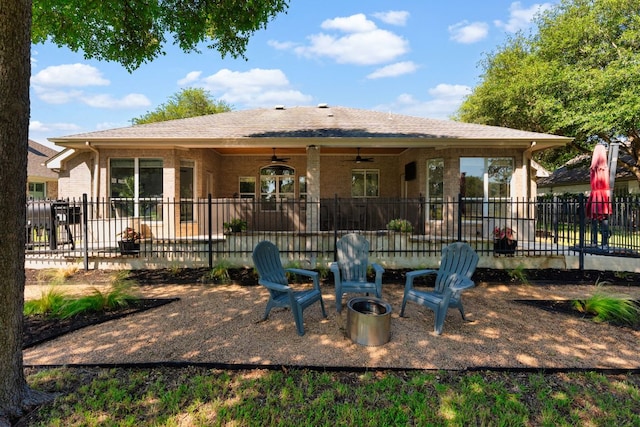 10833 Olympia Fields Loop, Austin, TX 78747 - back of house featuring ceiling fan, brick siding, a patio area, and a shingled roof