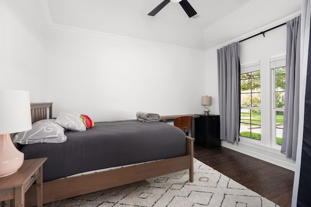 10833 Olympia Fields Loop, Austin, TX 78747 - bedroom featuring wood finished floors, a ceiling fan, vaulted ceiling, and ornamental molding