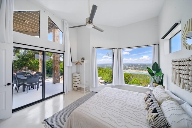 13902 Panorama Dr, Austin, TX 78732 - bedroom featuring access to outside, multiple windows, a ceiling fan, and a towering ceiling