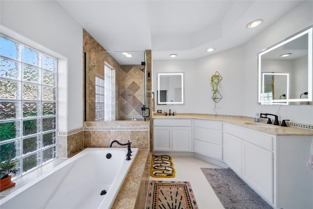 13902 Panorama Dr, Austin, TX 78732 - bathroom featuring double vanity, recessed lighting, a shower stall, and a garden tub
