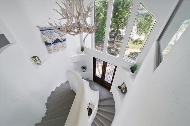 13902 Panorama Dr, Austin, TX 78732 - staircase with a high ceiling and french doors