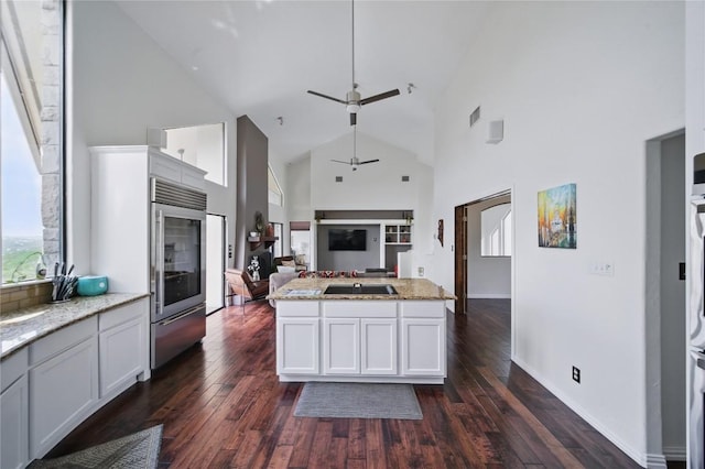 13902 Panorama Dr, Austin, TX 78732 - kitchen featuring high vaulted ceiling, ceiling fan, stainless steel fridge, open floor plan, and dark wood-style floors