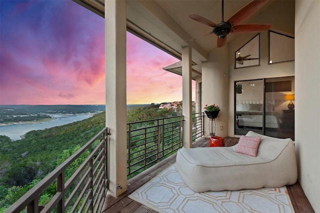 13902 Panorama Dr, Austin, TX 78732 - balcony at dusk with ceiling fan and a water view