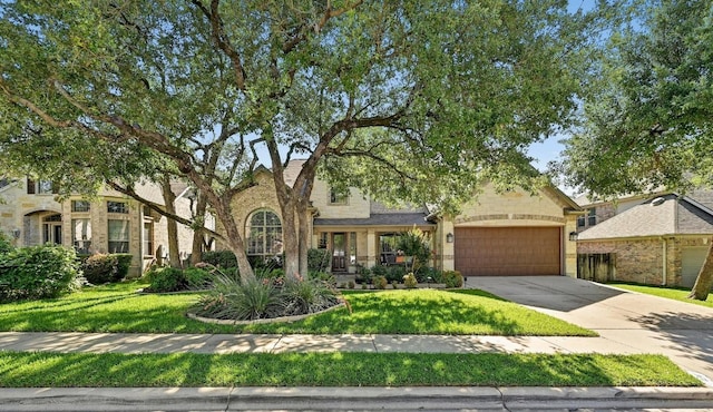 404 Riley Trl, Cedar Park, TX 78613 - obstructed view of property with concrete driveway, an attached garage, and a front lawn