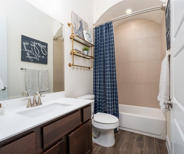 1225 Grassy Field Rd, Austin, TX 78737 - full bathroom featuring vanity, toilet, shower / bath combo with shower curtain, and wood tiled floors