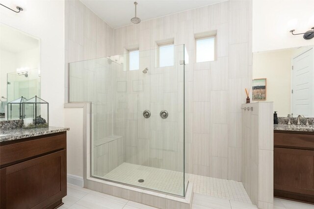 1225 Grassy Field Rd, Austin, TX 78737 - bathroom with a tile shower, vanity, and tile patterned flooring