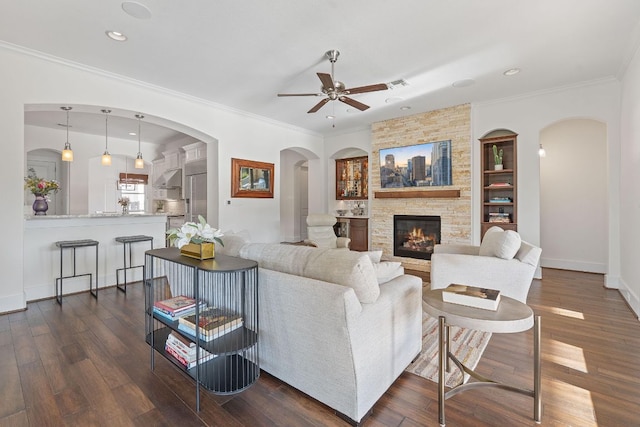 260 Unbridled, Austin, TX 78737 - living area with a ceiling fan, ornamental molding, a fireplace, dark wood-style flooring, and recessed lighting
