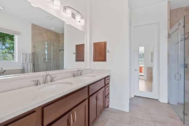 260 Unbridled, Austin, TX 78737 - bathroom featuring a stall shower, double vanity, and baseboards