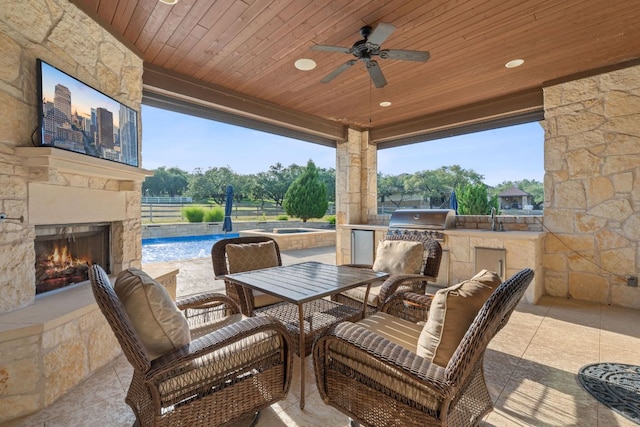 260 Unbridled, Austin, TX 78737 - view of patio with an outdoor stone fireplace, ceiling fan, outdoor dining space, an outdoor pool, and a sink