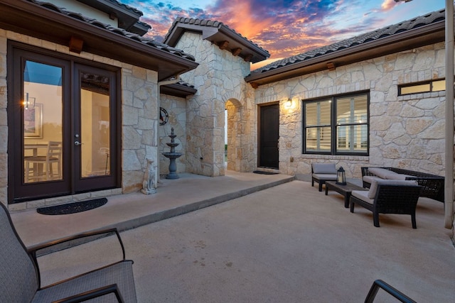 260 Unbridled, Austin, TX 78737 - patio terrace at dusk featuring a patio area