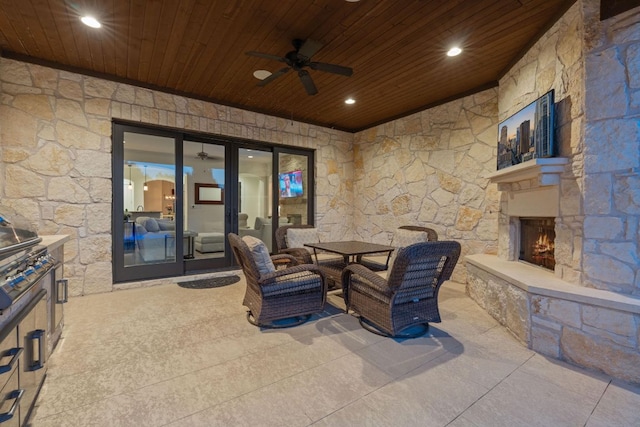 260 Unbridled, Austin, TX 78737 - view of patio / terrace with an outdoor stone fireplace, ceiling fan, outdoor dining area, and exterior kitchen