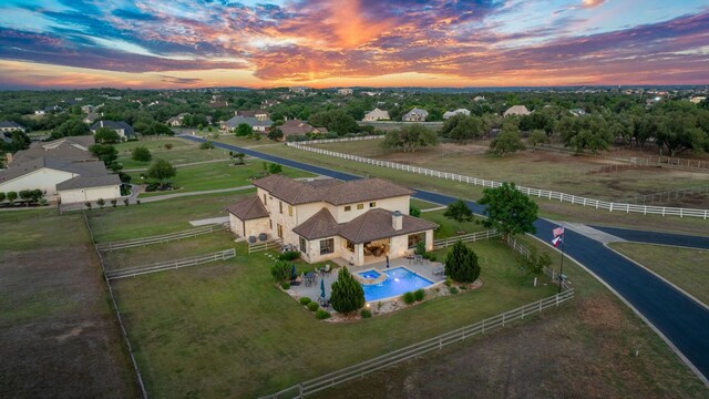 260 Unbridled, Austin, TX 78737 - aerial view at dusk of view of pool area and view of wooded area