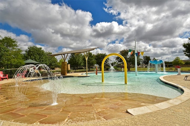 921 Stampede Rd, San Marcos, TX 78666 - community pool featuring a water play area