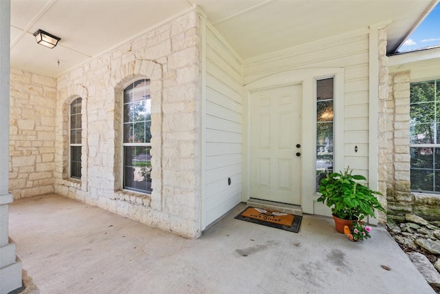 2128 Pearson Way, Round Rock, TX 78665 - doorway to property with stone siding and covered porch