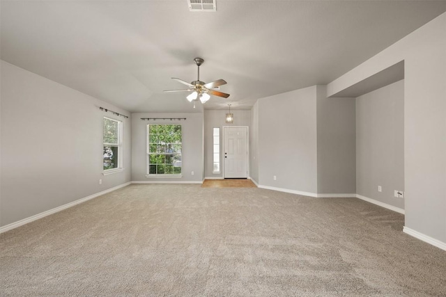 2128 Pearson Way, Round Rock, TX 78665 - empty room with light carpet, ceiling fan, and baseboards