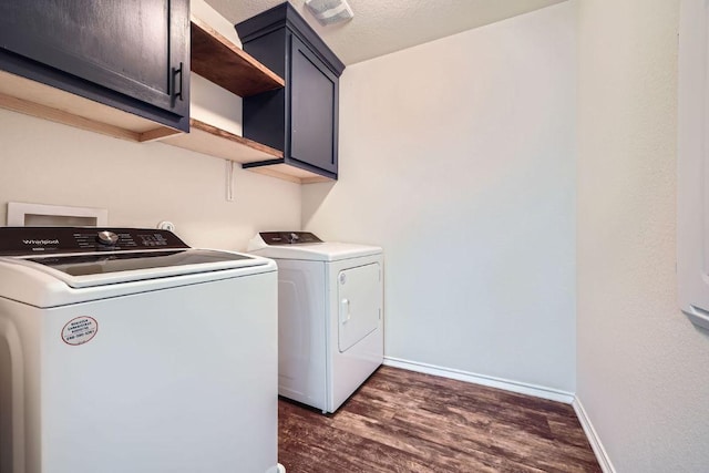 137 Green Egret Way, Leander, TX 78641 - laundry area featuring cabinet space, washing machine and dryer, dark wood-style flooring, and baseboards