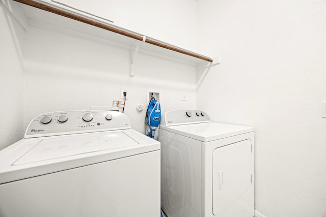 313 Pearl Way, Buda, TX 78610 - laundry area featuring washer and clothes dryer