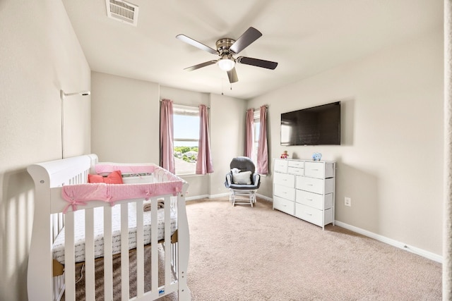 313 Pearl Way, Buda, TX 78610 - bedroom featuring a crib, carpet floors, and a ceiling fan