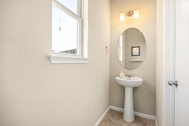 313 Pearl Way, Buda, TX 78610 - bathroom featuring plenty of natural light and tile patterned flooring