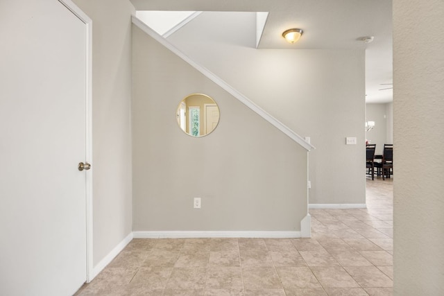 313 Pearl Way, Buda, TX 78610 - stairway with tile patterned floors and baseboards