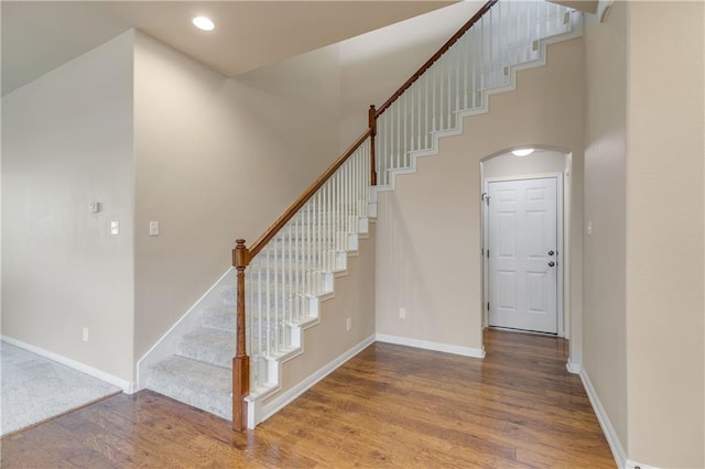 1911 Nelson Ranch Loop, Cedar Park, TX 78613 - staircase with arched walkways, wood finished floors, baseboards, and recessed lighting