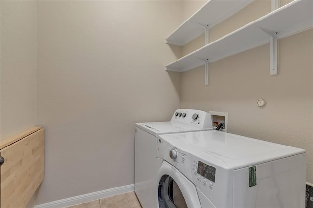 1911 Nelson Ranch Loop, Cedar Park, TX 78613 - laundry room featuring washer and clothes dryer, baseboards, and light tile patterned flooring