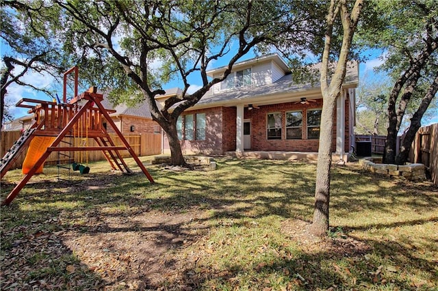 1911 Nelson Ranch Loop, Cedar Park, TX 78613 - back of house with a ceiling fan, a playground, cooling unit, and brick siding