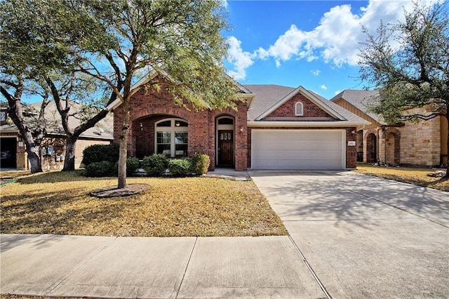 1911 Nelson Ranch Loop, Cedar Park, TX 78613 - traditional home with an attached garage, brick siding, driveway, and a front yard