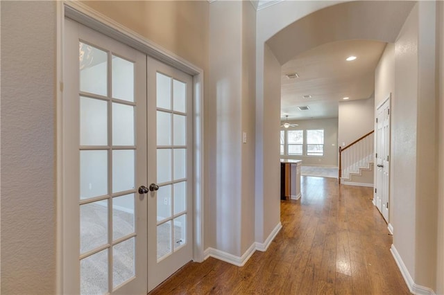 1911 Nelson Ranch Loop, Cedar Park, TX 78613 - hall with french doors, arched walkways, baseboards, and recessed lighting
