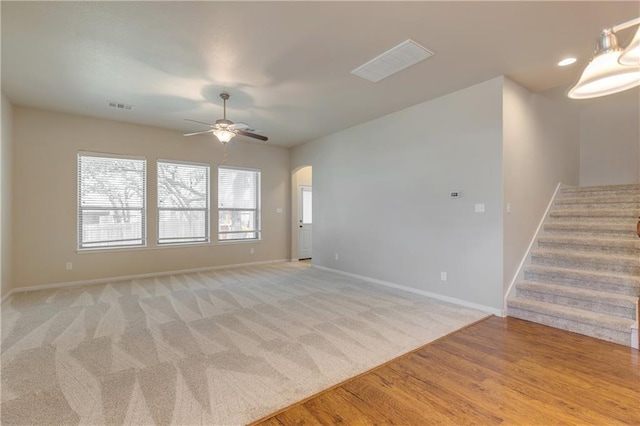 1911 Nelson Ranch Loop, Cedar Park, TX 78613 - empty room with baseboards, stairs, arched walkways, ceiling fan, and light wood-style floors