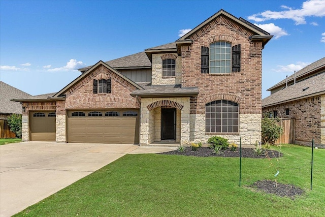 3908 Crispin Hall Ln, Pflugerville, TX 78660 - french country home featuring driveway, roof with shingles, an attached garage, board and batten siding, and stone siding