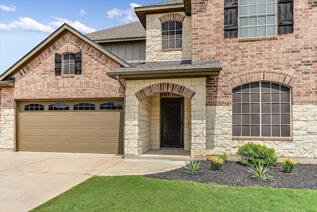 3908 Crispin Hall Ln, Pflugerville, TX 78660 - french country inspired facade featuring concrete driveway, stone siding, board and batten siding, and a shingled roof