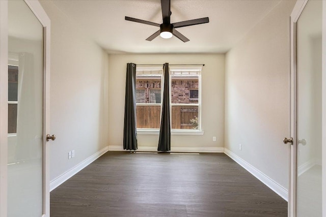3908 Crispin Hall Ln, Pflugerville, TX 78660 - unfurnished room with dark wood-type flooring, ceiling fan, and baseboards