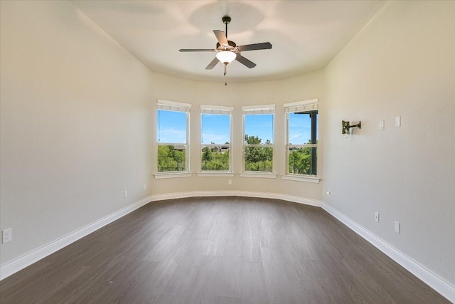 3908 Crispin Hall Ln, Pflugerville, TX 78660 - unfurnished room with ceiling fan, dark wood finished floors, and baseboards