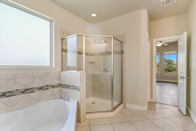 3908 Crispin Hall Ln, Pflugerville, TX 78660 - bathroom with a whirlpool tub, a shower stall, tile patterned floors, and baseboards