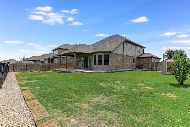3908 Crispin Hall Ln, Pflugerville, TX 78660 - back of house featuring brick siding, a patio, and central AC