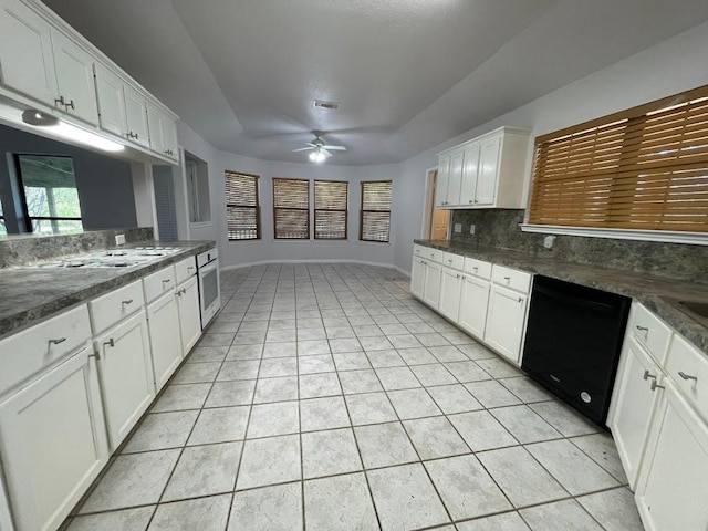 5001 Blue Bluff Rd, Austin, TX 78724 - kitchen with black dishwasher, ceiling fan, light tile patterned floors, backsplash, and wall oven