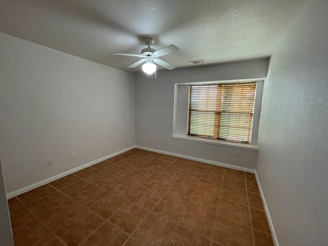 5001 Blue Bluff Rd, Austin, TX 78724 - empty room featuring a ceiling fan, baseboards, and a textured ceiling