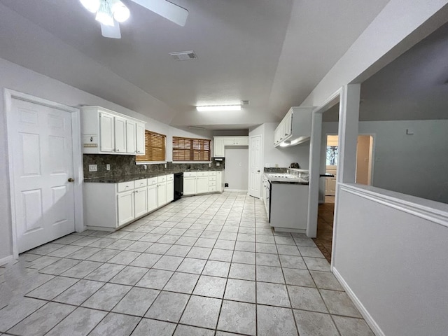 5001 Blue Bluff Rd, Austin, TX 78724 - kitchen featuring a ceiling fan, backsplash, white cabinets, lofted ceiling, and black dishwasher
