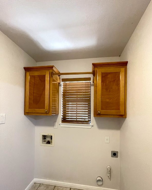 5001 Blue Bluff Rd, Austin, TX 78724 - laundry room featuring electric dryer hookup, hookup for a gas dryer, baseboards, cabinet space, and washer hookup
