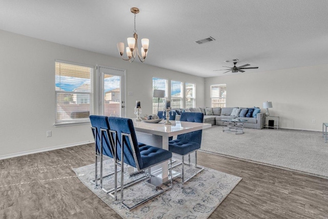 18909 James Carter Jr St, Manor, TX 78653 - dining area featuring a chandelier and ceiling fan