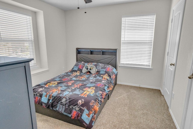 18909 James Carter Jr St, Manor, TX 78653 - carpeted bedroom featuring baseboards and ceiling fan