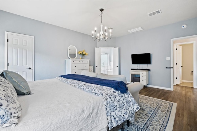 809 Bedford Ct, Georgetown, TX 78628 - bedroom featuring a chandelier, wood finished floors, and baseboards