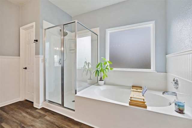 809 Bedford Ct, Georgetown, TX 78628 - full bathroom featuring a stall shower, wood finished floors, and a bath