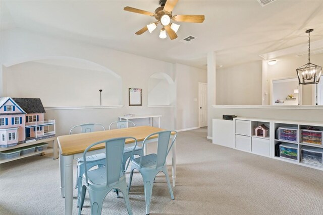 809 Bedford Ct, Georgetown, TX 78628 - dining area featuring carpet floors, a ceiling fan, and a chandelier