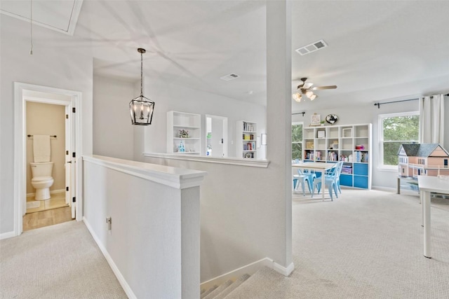 809 Bedford Ct, Georgetown, TX 78628 - corridor featuring an upstairs landing, carpet flooring, attic access, and baseboards