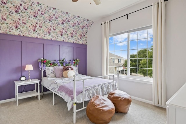 809 Bedford Ct, Georgetown, TX 78628 - bedroom with wallpapered walls, light carpet, ceiling fan, baseboards, and wainscoting