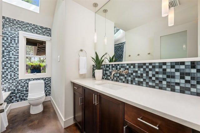 4305 Cliffwood Cir, Austin, TX 78759 - full bathroom with tasteful backsplash, vanity, concrete flooring, a skylight, and curtained shower