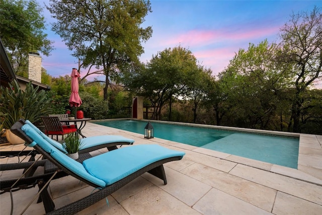 4305 Cliffwood Cir, Austin, TX 78759 - pool at dusk featuring a patio area and an outdoor pool